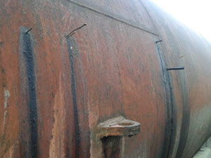 Wooden pegs plug leaking fatty acid tank Wooden pegs plug leaking fatty acid tank