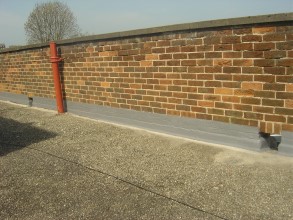 Sealed flashing at parapet wall resulting in long-term roof protection Sealed flashing at parapet wall resulting in long-term roof protection